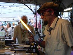 Fair Glass Blower Holding Blow Torch | Glass Blowing - Daily Entertainment